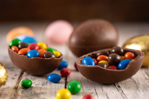 colorful-chocolate-easter-eggs-wooden-table