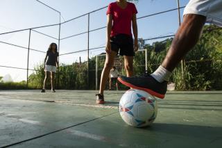side-view-friends-playing-soccer (1)
