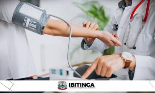 editeyoung-male-psysician-with-patient-measuring-blood-pressure