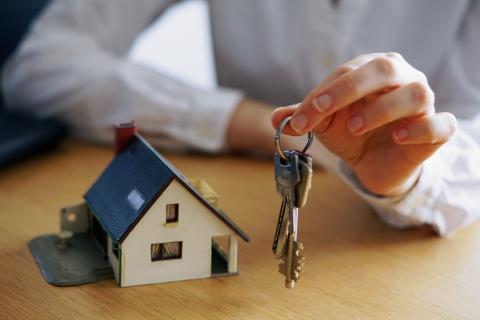 closeup-shot-person-thinking-buying-selling-house