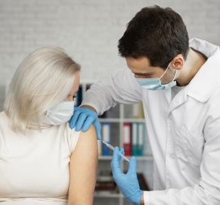 medium-shot-woman-getting-a-vaccine