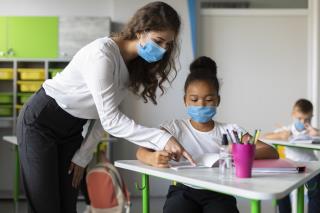 teacher-showing-student-how-solve-problem