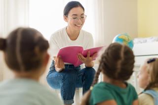 front-view-woman-reading-something-for-her-students