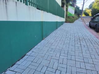 105.. - Instalação de calçada tipo segura no bairro Bela Vista
